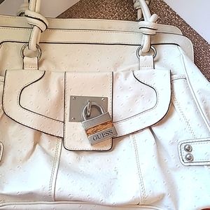 Guess purse, white ostrich pattern, good condition.